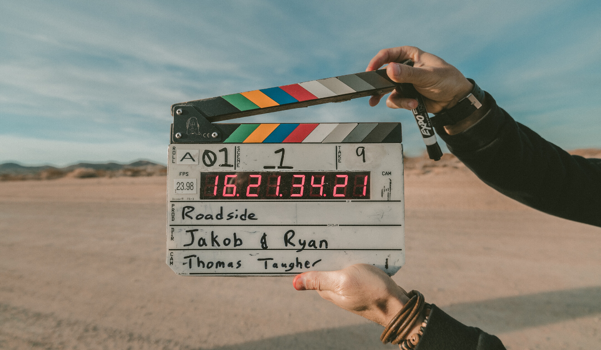 Milk Bottle Shopify webinar -- Going back to basics on Shopify. Image of movie clapper board in desert