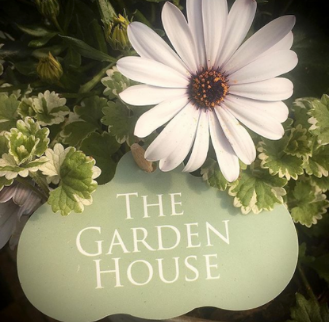 The Garden House logo with flower. Garden Centre in Malahide, Co Dublin selling on Shopify