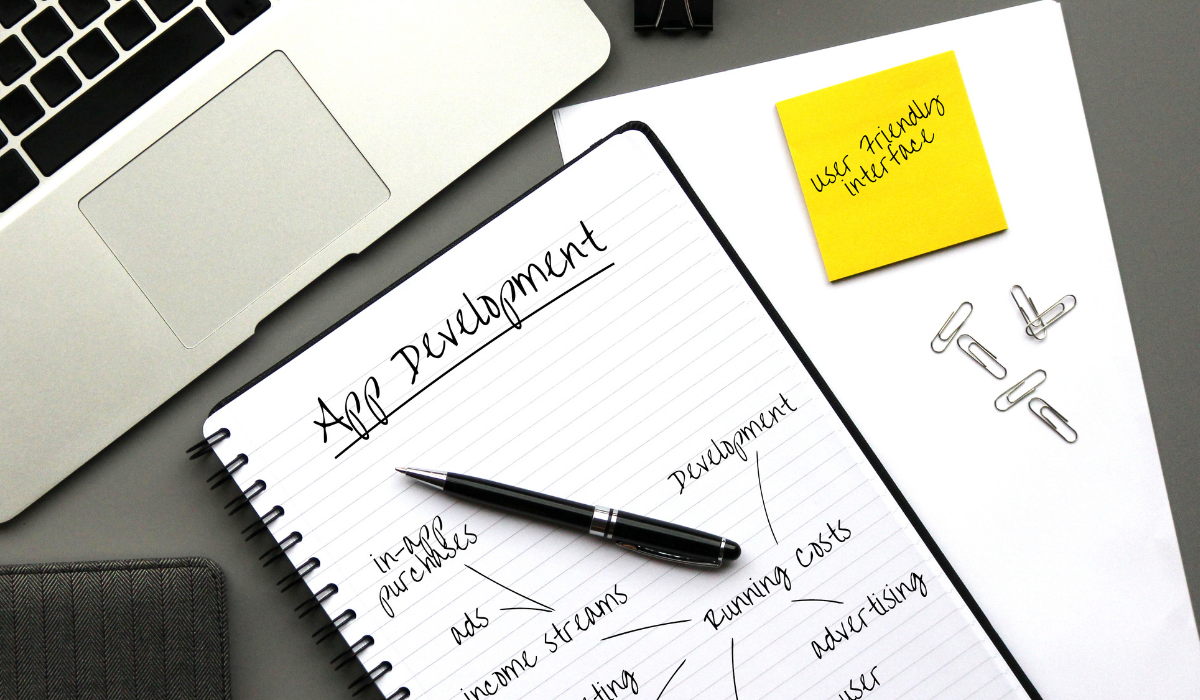 Shopify App Development notebook and macbook