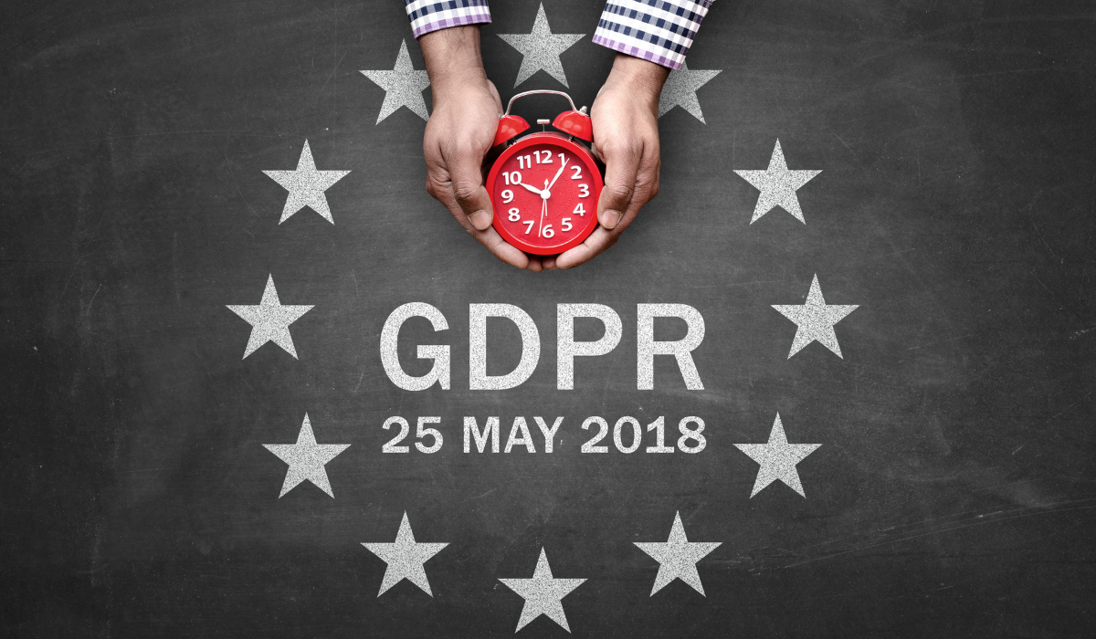 GDPR is around the corner. Hands holding a clock over GDPR 25 May 2018