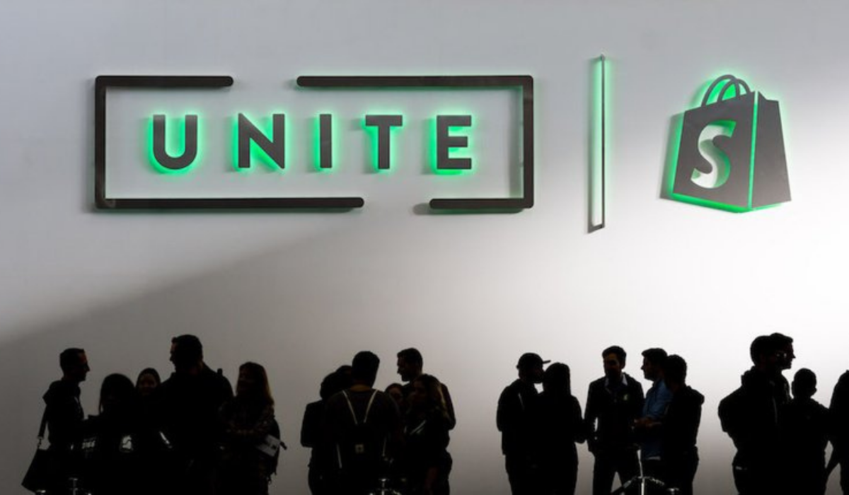 shopify unite 2017 gathering of people in front of sign