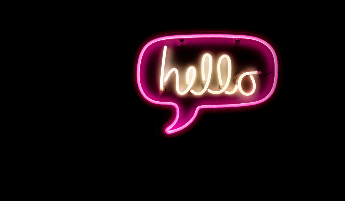 increase sales with personalised emails blog post by Milk Bottle Labs. Image of neon light speech bubble saying hello.